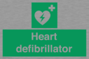 green-background-with-white-text-and-heart-defibrillator-symbol--white-cross-and~